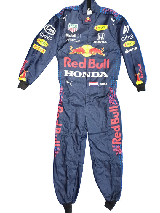 A navy Red Bull Racing Honda one-piece racing suit with various sponsor logos and the Red Bull logo, laid flat on a crumpled blue background.