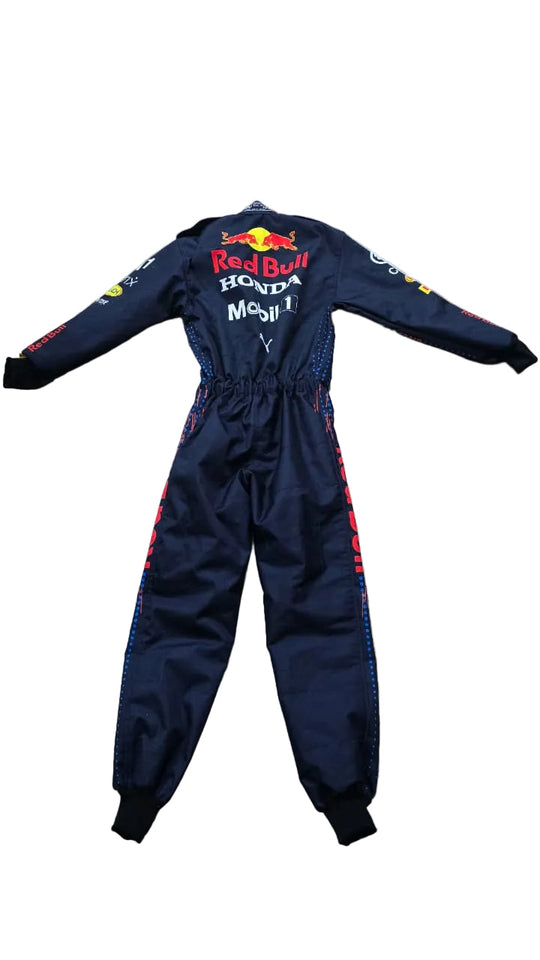 A dark navy Red Bull Racing Honda motorsport one-piece suit with Red Bull, Honda, and Mobil 1 branding, laid flat on a beige marble floor.