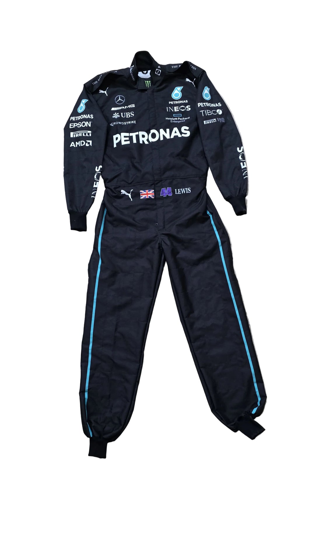 A black Mercedes Petronas racing suit with light blue side stripes and various sponsor logos, laid flat on a beige marble floor.