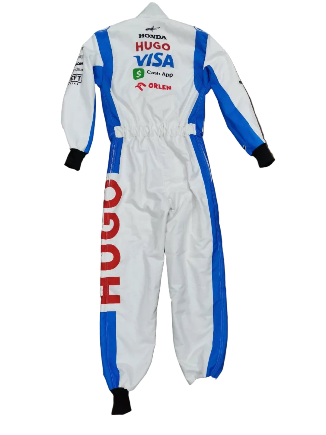 A white one-piece racing suit with blue and red sponsor logos, laid flat on a brown surface.