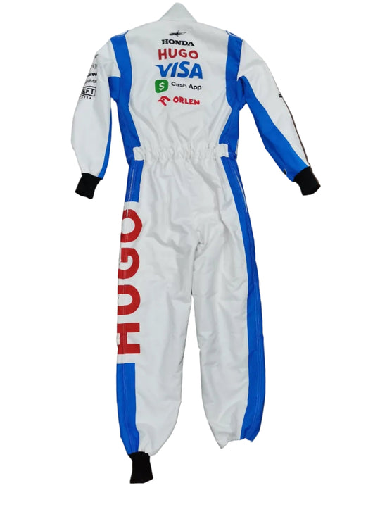 A white one-piece racing suit with blue and red sponsor logos, laid flat on a brown surface.