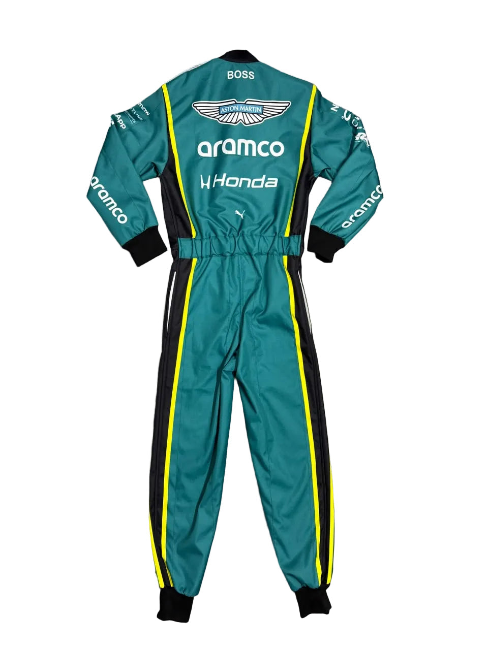 A teal racing one-piece jumpsuit with black and yellow side stripes, laid flat on a gray marble tile floor. The back of the suit features white logos for BOSS, aramco, and WHonda, along with the Aston Martin wing emblem.