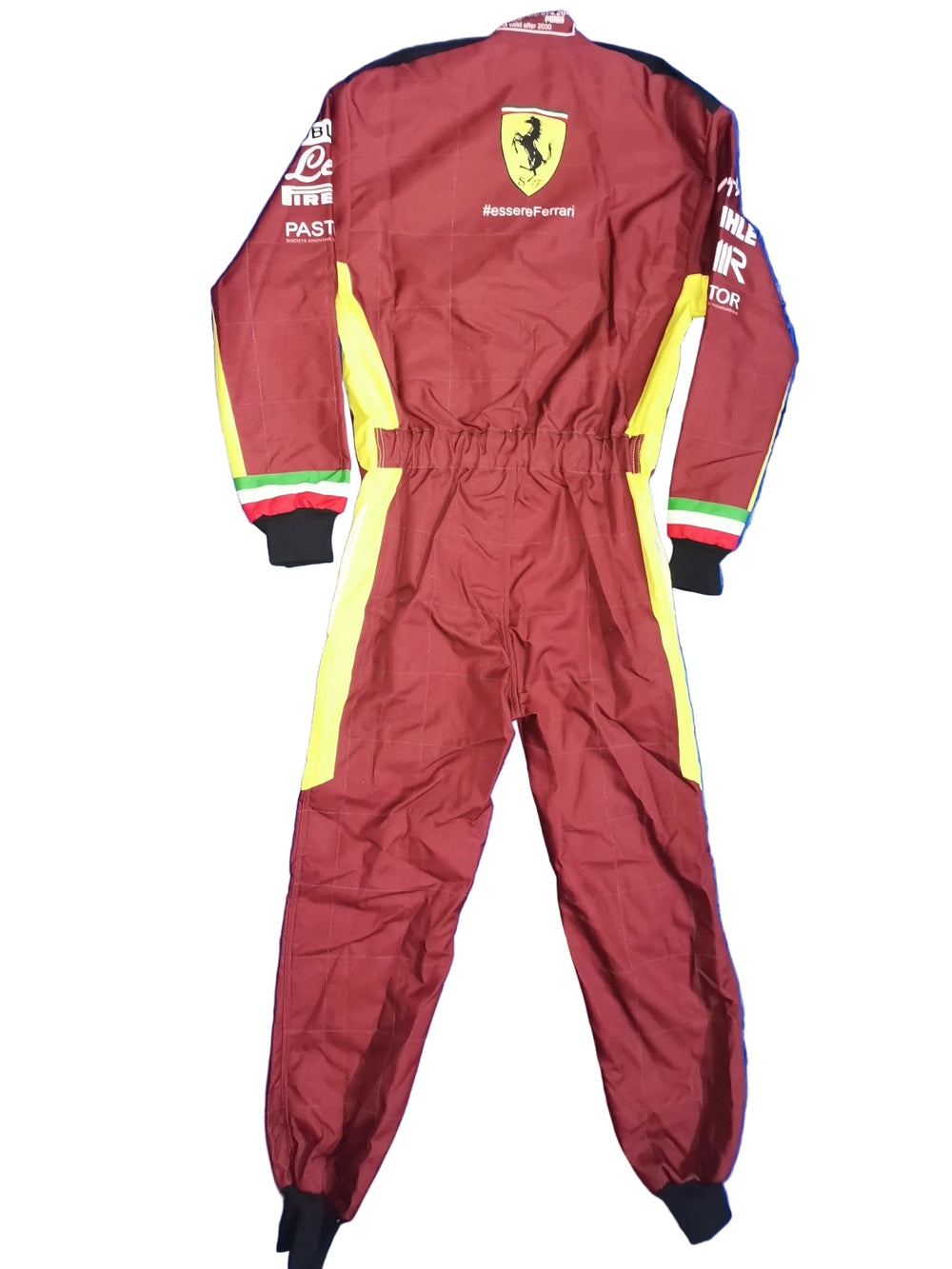 A maroon Ferrari one-piece racing suit with yellow side panels and sleeve stripes, laid flat on a blue wrinkled sheet. The back shows the Ferrari shield logo and sponsor logos.