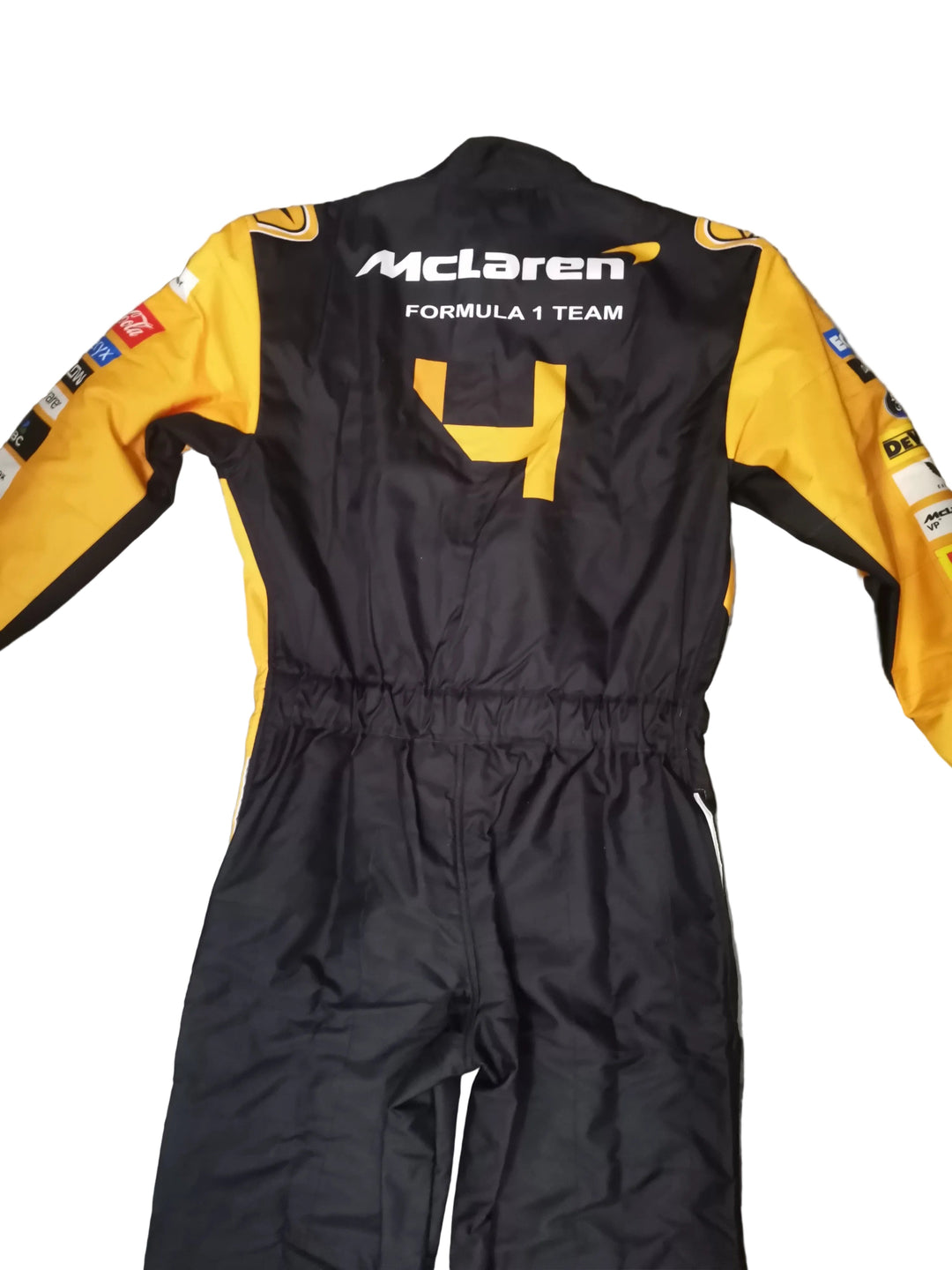 A black and yellow McLaren Formula 1 Team racing suit laid flat on a gray marble-patterned floor. The back of the suit features the white 'McLaren Formula 1 Team' logo, a large yellow number 4, and sponsor logos along the sleeves.