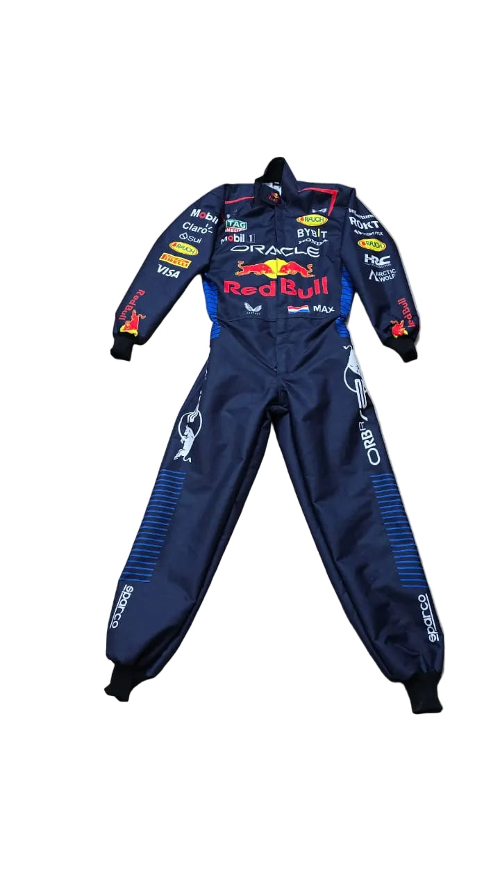 A dark navy blue Red Bull racing one-piece suit with multiple sponsor logos, laid flat on a beige tiled floor.