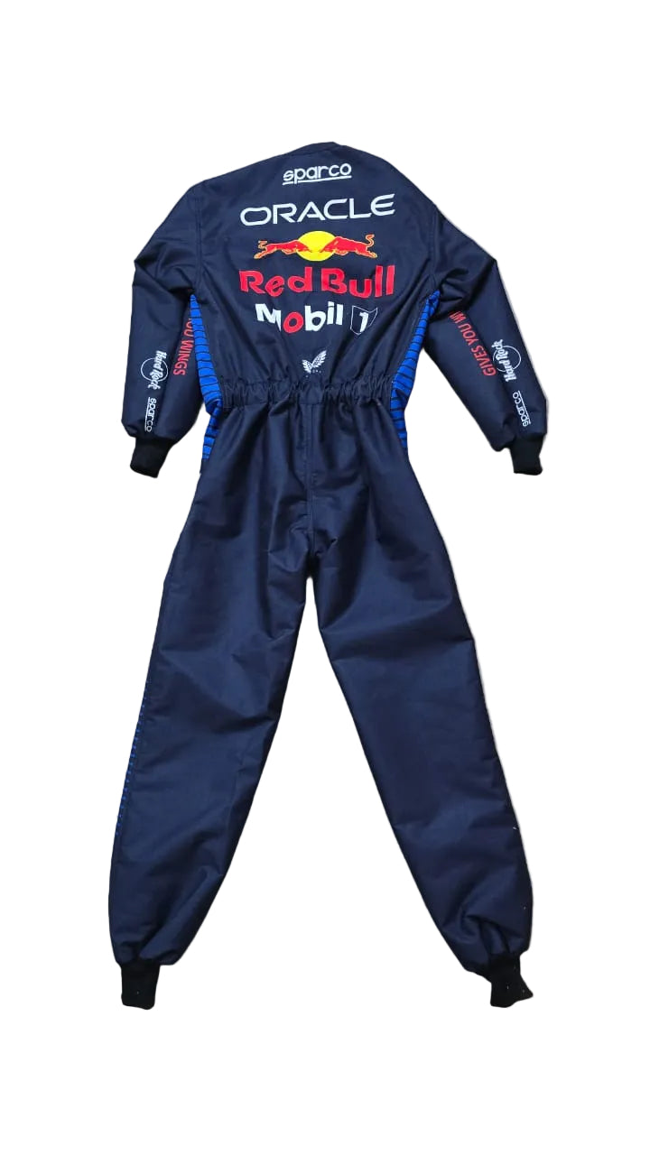 A navy blue Oracle Red Bull Racing driver's jumpsuit by Sparco, laid flat on a beige tiled floor. The back of the suit features prominent white, red, and yellow sponsor logos including Oracle, Red Bull, and Mobil 1.