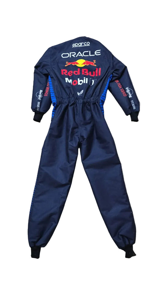 A navy blue Oracle Red Bull Racing driver's jumpsuit by Sparco, laid flat on a beige tiled floor. The back of the suit features prominent white, red, and yellow sponsor logos including Oracle, Red Bull, and Mobil 1.